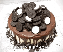 a birthday cake with oreos on top and the words happy birthday below