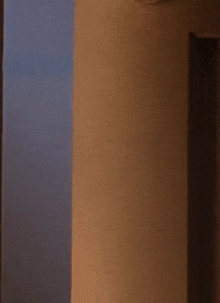 a close up of a person 's fingers sticking out from behind a wall