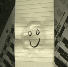 a paper with a smiley face drawn on it