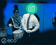 a man in a marching band has a green circle with a n on it