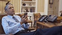 Laughing Barack Obama GIF - Laughing Barack Obama Texting GIFs