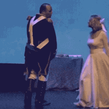 a pixelated image of a man and a woman dancing on a stage