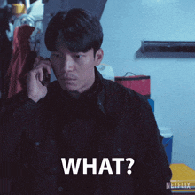 a man is talking on a cell phone and the word what is on his face