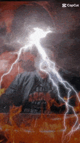 a man is being struck by lightning while wearing a shirt that says built for rock
