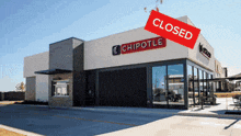 a chipotle restaurant with a closed sign on it
