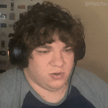 a man wearing headphones has the name matchu written on the bottom