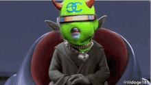 a cartoon character with a green face and horns is sitting in a chair with the username lildoge18