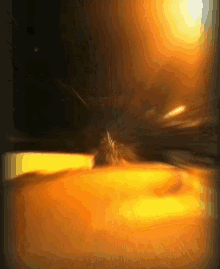 a blurred image of a person standing in a dark room