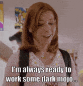 a woman in a pink sweater says " i 'm always ready to work some dark mojo ... "