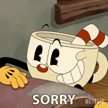 cuphead from netflix is laying on a couch