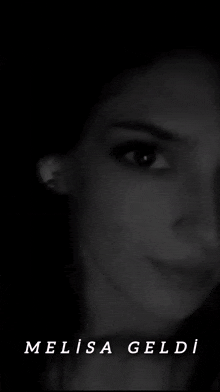 a black and white photo of a woman 's face with a lightning bolt behind her and the words melisa geldi below her