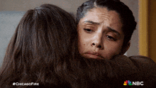 two women hugging each other with nbc written on the bottom left