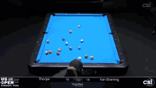 a pool table with a blue cloth that says diamond