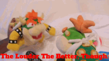 two stuffed animals are laying on a bed with the words " the louder the better though " in red