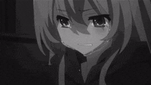 a black and white photo of a girl wearing a mask .