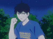 a boy wearing a blue kan-nico channel shirt