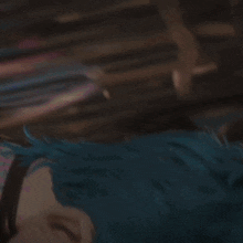 a close up of a cartoon character 's face with blue hair