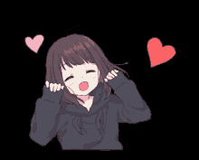 a girl in a black hoodie is surrounded by hearts