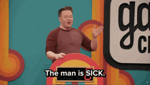 a man stands at a podium with the words " the man is sick " on it