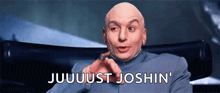 a bald man sitting in a chair with the words juuuuust joshin