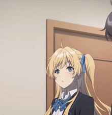 a girl with blonde hair has a blue bow on her hair