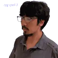 a pixelated image of a man wearing glasses and a grey shirt