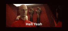 a bald man in a red shirt with the words hell yeah written below him