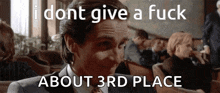 a man in a suit and tie says " i dont give a fuck about 3rd place " in front of a crowd of people