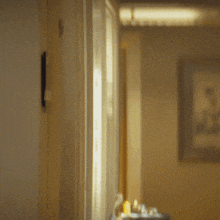 a man in a suit and tie is peeking through a door