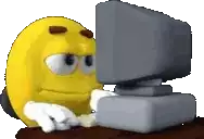 a yellow smiley face is looking at a computer screen