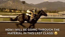 a jockey is riding a black horse on a race track .