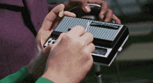 a person is holding a device that says stylestar