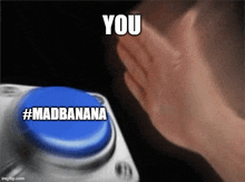 a person is pressing a blue button that says you #madbanana .