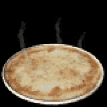 a pizza is being cooked in a pan on a black background .