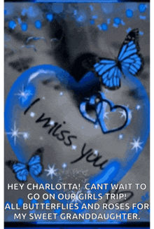 a blue heart with butterflies and the words " i miss you "
