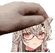a hand is touching a girl 's face with a hat on .