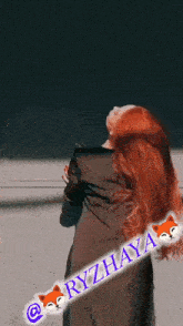 a picture of a woman with red hair and the name ryzhaya on the bottom