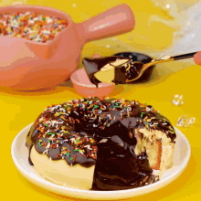 a person is taking a bite out of a chocolate donut