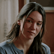 a close up of a woman 's face with her eyes closed