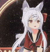 a girl with white hair and fox ears is standing in front of a window .