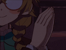 a close up of a person 's hands making a peace sign