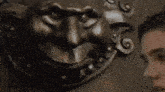 a woman is knocking on a door with a lion 's head .