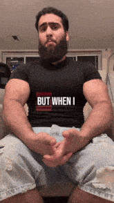 a man with a beard wears a shirt that says but when i