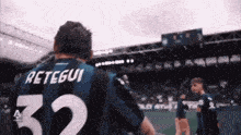 a man in a striped jersey with the number 32 on it