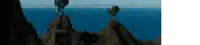 a blurry picture of a cliff overlooking a body of water .