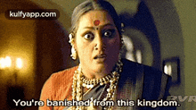 a woman with a red dot on her forehead is saying you 're banned from this kingdom .