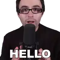 a man wearing glasses is talking into a shure microphone and says hello
