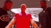 three men are standing next to each other wearing van dutch shirts .