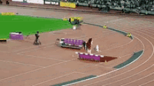 a track and field stadium with a couch on the side of it