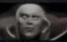 a blurry picture of a person 's face with a skull on it .